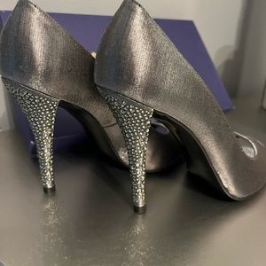 Showy Satin peep toe pump . Stewart Weitzman